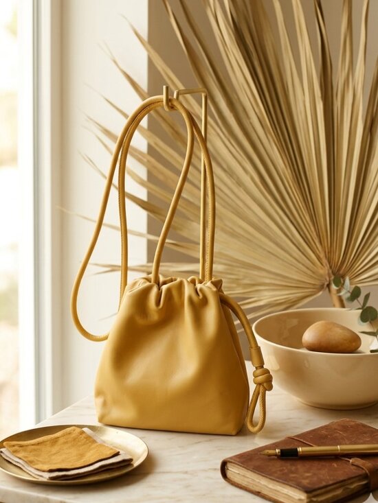 a new day Handbags - A New Day Mustard Yellow Knotted Pouch Crossbody Bag Mini